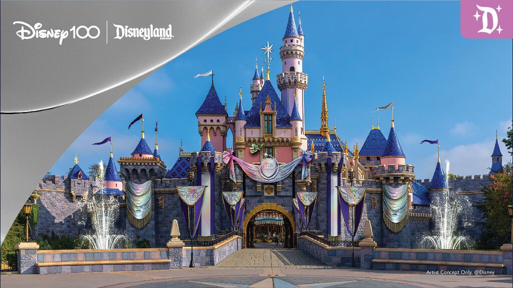 Disney100 at Disneyland Image of Disneyland's iconic castle adorned with decorations for Disney's 100th anniversary, under a clear blue sky.