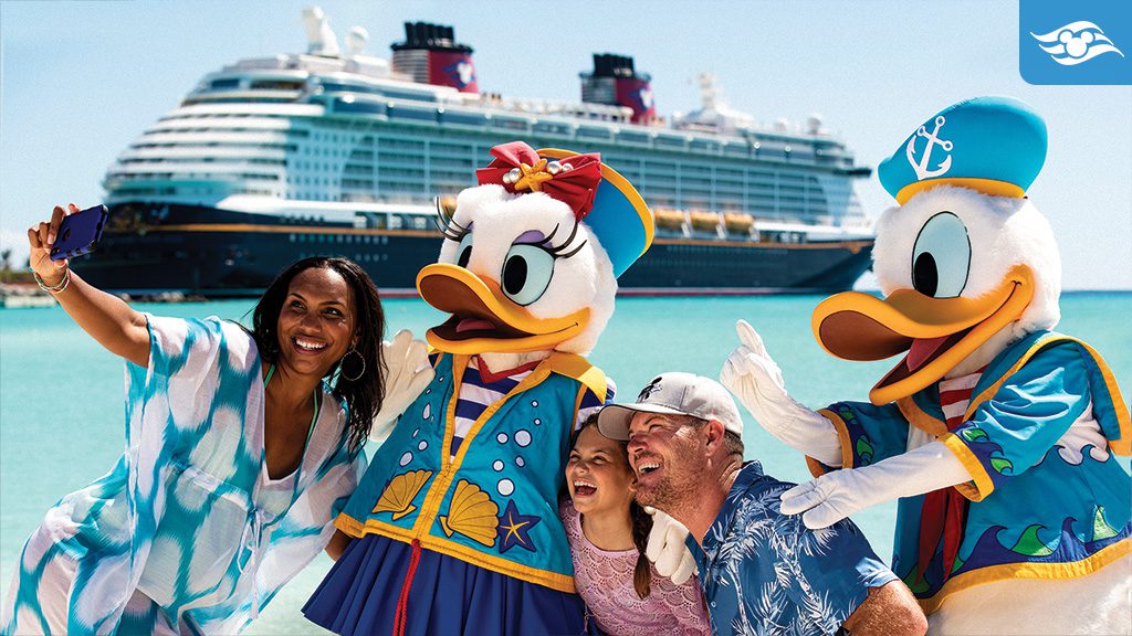 A family poses for a selfie with costumed characters, Daisy and Donald Duck, with a cruise ship in the background and clear blue water.
