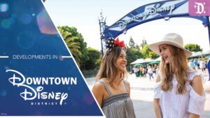 Two young women are smiling and chatting under a "Downtown Disney" archway, with trees and people in the background. Brand logo displayed.