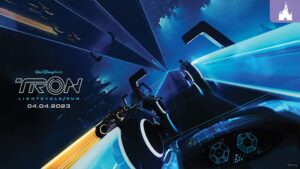 A vibrant graphic featuring sleek light cycles racing through a digital landscape, promoting "TRON Lightcycle Run," opening April 4, 2023.