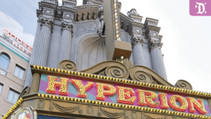 The image features the ornate facade of the Hyperion Theatre, showcasing its decorative marquee and classical architectural elements.