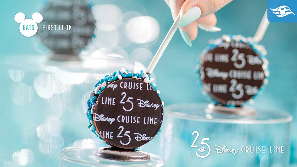 Two chocolate-covered treats decorated with blue sprinkles and marked with "Disney Cruise Line 25" on a colorful display.