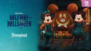 Mickey and Minnie Mouse dressed in Halloween attire stand next to a cheerful pumpkin, promoting Disney’s "Halfway to Halloween" event.