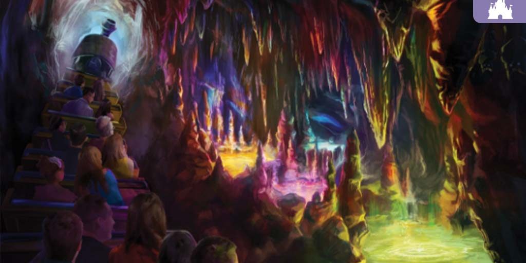 Colorful glowing cave scene from Big Thunder Mountain Railroad with riders on a train passing bright Rainbow Caverns and shimmering rock formations