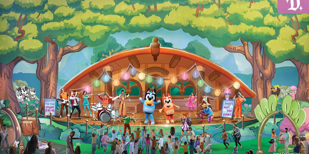 Bluey and Bingo perform on a colorful outdoor stage at Disneyland’s Fantasyland Theatre as kids dance and musicians play during “Bluey’s Best Day Ever!” show.