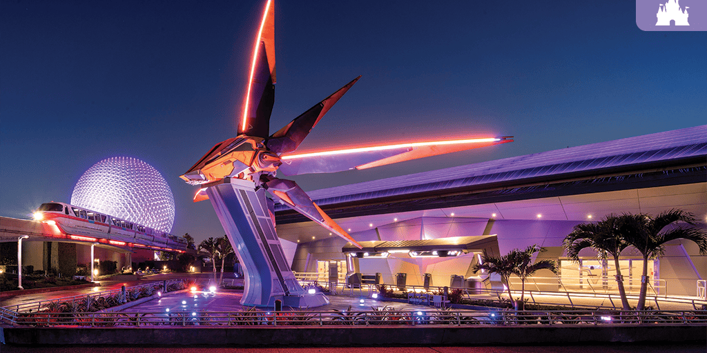 Geodesic sphere lit in purple at dusk, monorail passing an illuminated pavilion with a red neon-lit futuristic sculpture over a reflecting pool.