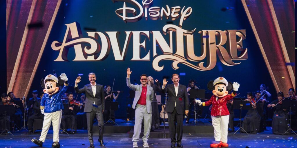 Disney Adventure christening ceremony with Robert Downey Jr., Disney executives, Captain Mickey and Minnie, and orchestra at Marina Bay Cruise Centre Singapore.