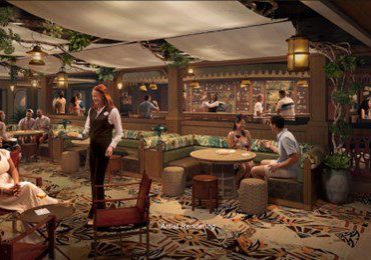 A warm, inviting lounge with tropical decor. Guests relax at tables, while a server interacts with patrons in a vibrant, lively atmosphere.