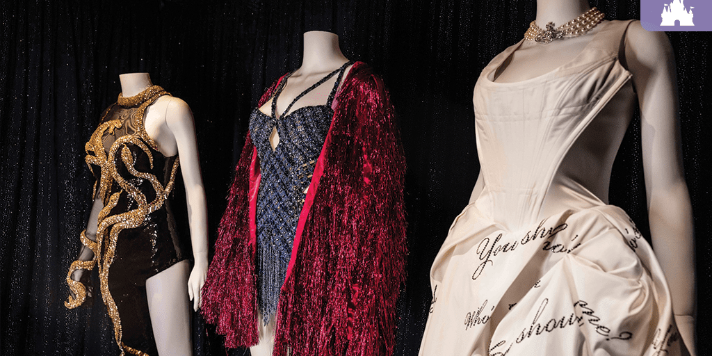 Taylor Swift Eras Tour costumes on display at Disney, featuring outfits from “reputation,” “Midnights,” and “THE TORTURED POETS DEPARTMENT.”