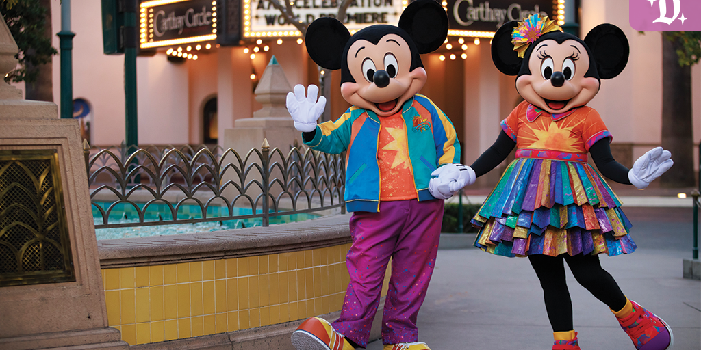 Mickey and Minnie Mouse wear colorful 25th anniversary outfits in front of Carthay Circle at Disney California Adventure.