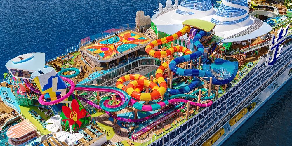 Aerial artist's rendering of Royal Caribbean's Hero of the Seas featuring colorful waterslides, a basketball court, and resort-style decks at sea.