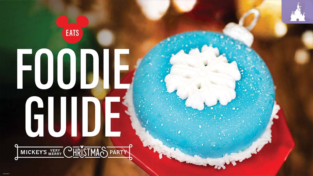 christmas-party-foodie-guide-2025 Foodie Guide cover for Mickey’s Very Merry Christmas Party, featuring a blue ornament-shaped dessert topped with a white snowflake.