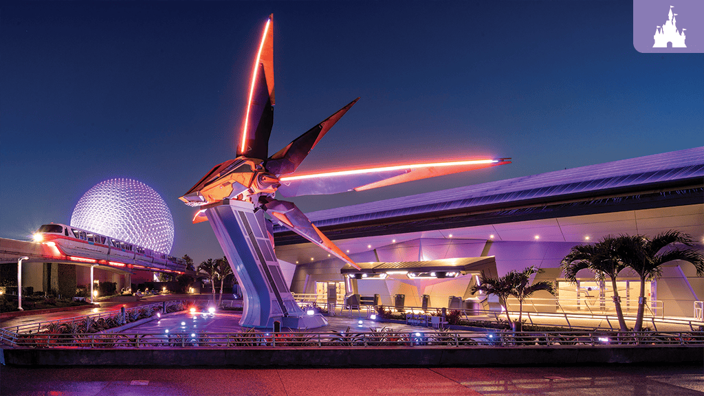 Geodesic sphere lit in purple at dusk, monorail passing an illuminated pavilion with a red neon-lit futuristic sculpture over a reflecting pool.