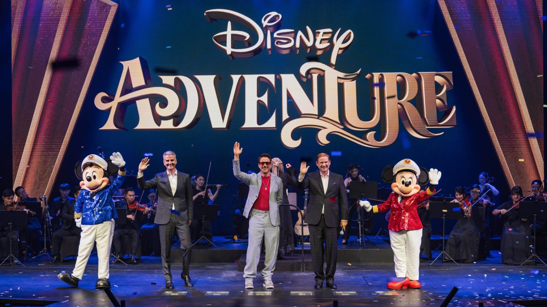 Disney Adventure christening ceremony with Robert Downey Jr., Disney executives, Captain Mickey and Minnie, and orchestra at Marina Bay Cruise Centre Singapore.