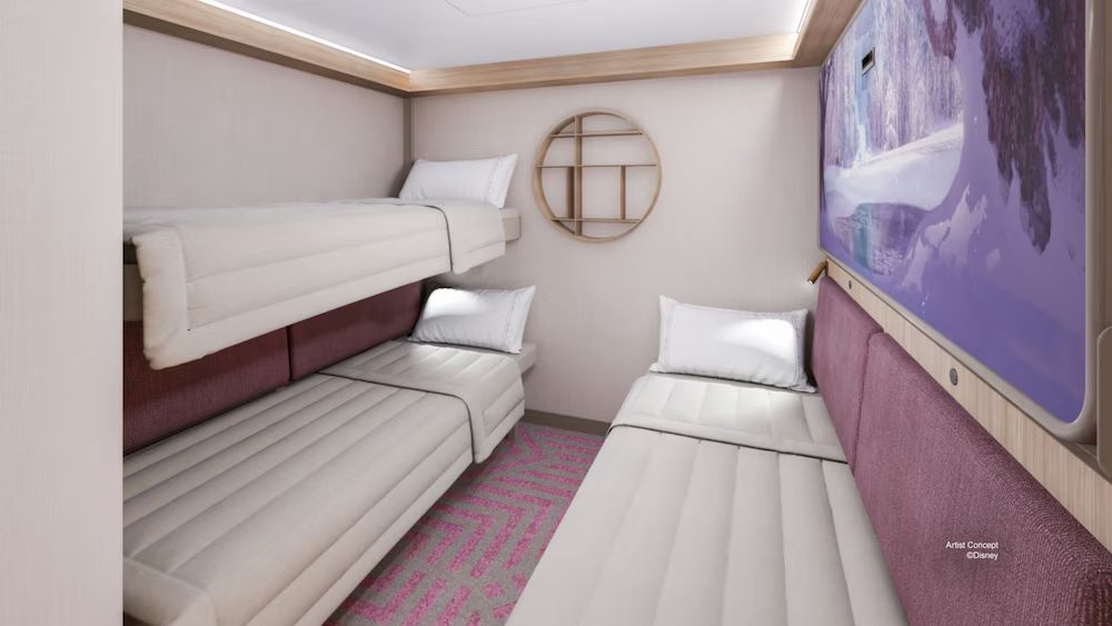 Cozy Disney Cruise Line inside stateroom with nautical-themed decor, comfortable bedding, and ambient lighting.