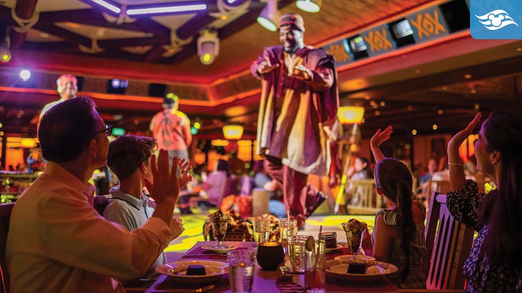 Guests enjoy live musical entertainment at Disney Destiny's Lion King-themed restaurant, with performers in African-inspired attire engaging the audience.