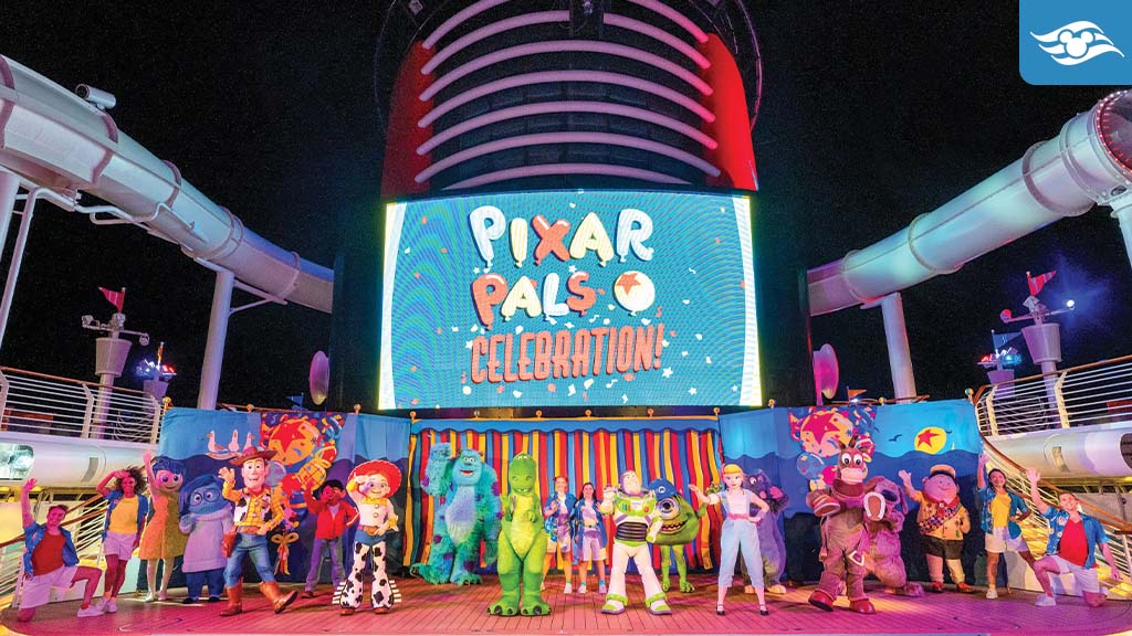 disney-cruise-line-marvel-pixar-day-at-sea-2026 Pixar characters perform on a Disney Cruise ship deck during the vibrant Pixar Pals Celebration at night.