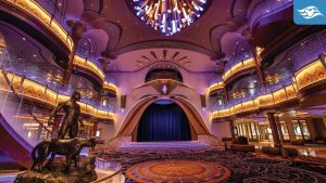 The Grand Hall aboard the Disney Destiny, featuring a statue of Black Panther and a panther, with elegant Wakandan-inspired design, glowing lights, and a vibrant chandelier.