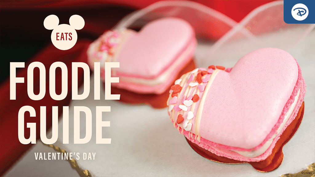 disney-valentines-day-2024-foodie-guide A close-up of pink heart-shaped macarons decorated with sprinkles, accompanied by text: "Foodie Guide" for Valentine's Day. Mickey Mouse logo included.