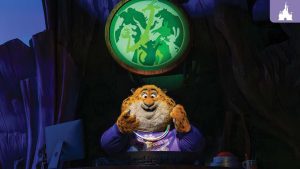 Audio-Animatronic figure of Clawhauser from Zootopia in glow accessories at Disney’s Animal Kingdom's Tree of Life Theater.