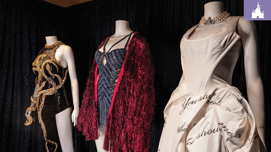 Taylor Swift Eras Tour costumes on display at Disney, featuring outfits from “reputation,” “Midnights,” and “THE TORTURED POETS DEPARTMENT.”