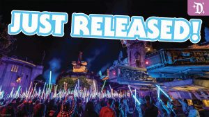 A vibrant scene at night with a crowd holding glowing lightsabers, featuring the text "JUST RELEASED!" prominently displayed.