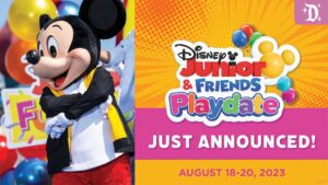 A cheerful character in a black mouse costume stands beside colorful balloons, announcing Disney Junior & Friends Playdate, August 18-20, 2023.