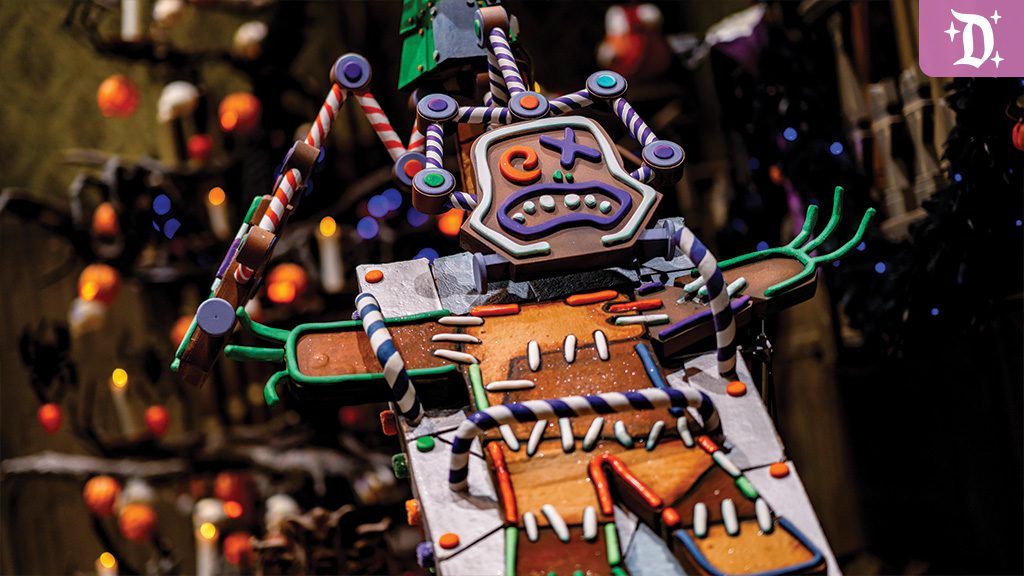 disneyland-haunted-mansion-holiday-gingerbread-house Close-up of a spooky gingerbread figure at Disneyland's Haunted Mansion Holiday, decorated with colorful candy details and eerie expressions.