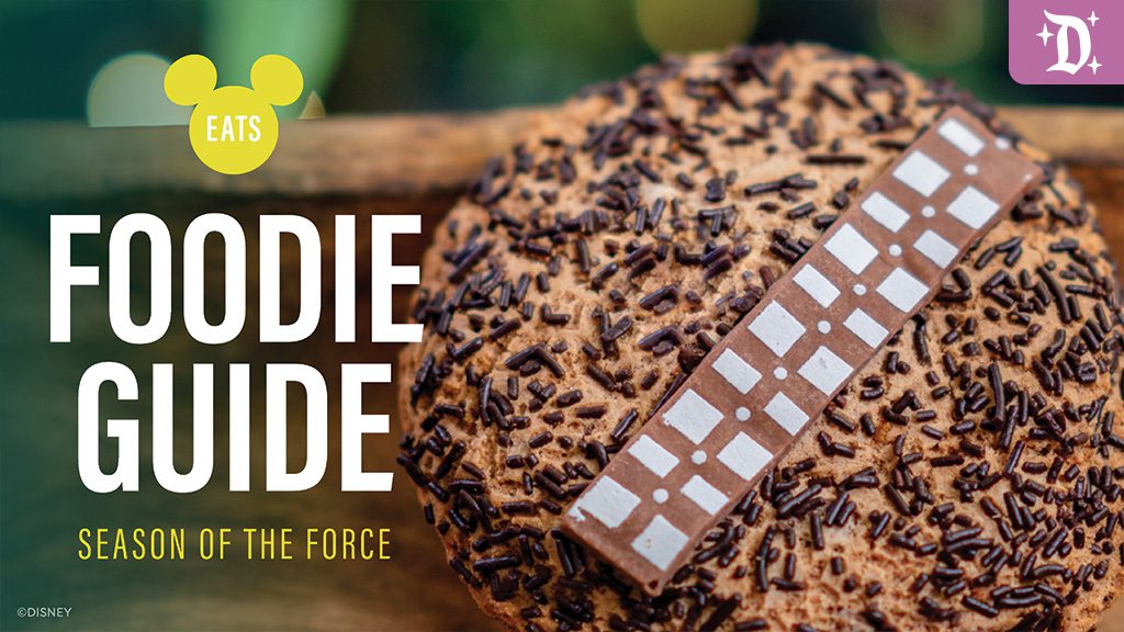 A large, chocolate-covered cookie topped with sprinkles and a chocolate bar, featuring the text "Foodie Guide" and "Season of the Force."