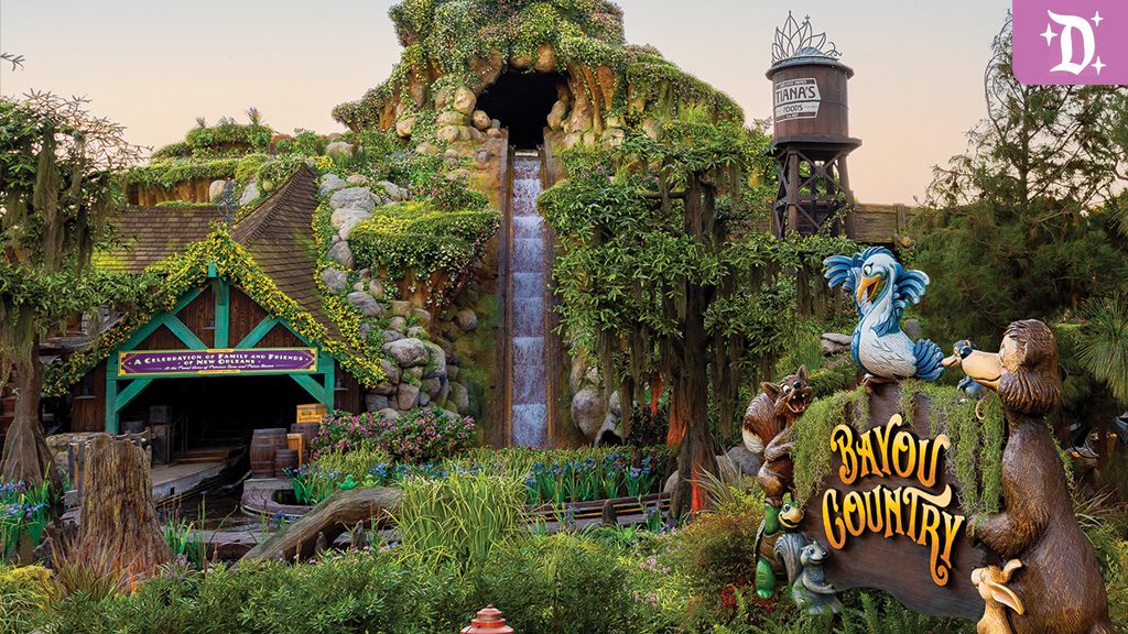 Entrance to Tiana’s Bayou Adventure in Disneyland's Bayou Country, featuring a rustic log flume ride with lush greenery, playful critter statues, and Tiana's Foods water tower in the background.