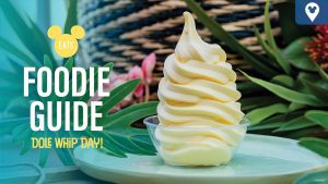 An inviting Dole Whip soft serve in a clear cup, surrounded by tropical greenery, with text promoting Dole Whip Day.