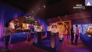 A display at the 2025 EPCOT Festival of the Arts featuring costumes and props from Aladdin and The Lion King, with guests exploring the exhibit.