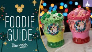 Holiday-themed Miss Piggy and Kermit dessert cups filled with festive green and pink ice cream, topped with sprinkles and M&M's at Disney Jollywood Nights 2025.