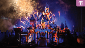 A colorful castle illuminated by fireworks, set against a twilight sky, creating a magical atmosphere.