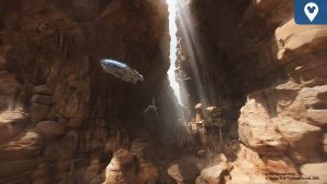 Millennium Falcon and another starship fly through a sunlit canyon on a desert planet, concept art for Disney's Smugglers Run update.