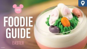 A colorful Easter-themed dessert featuring edible bunny decorations, set against a backdrop with "Foodie Guide" text.