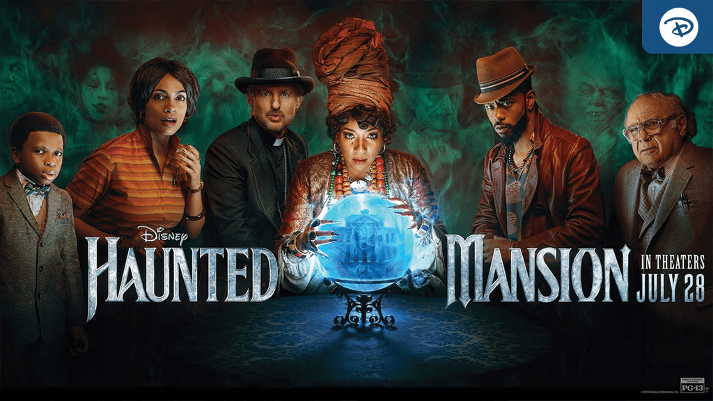 A group of characters stands around a glowing crystal ball, with a spooky green mist in the background. Text reads "Haunted Mansion, in theaters July 28."