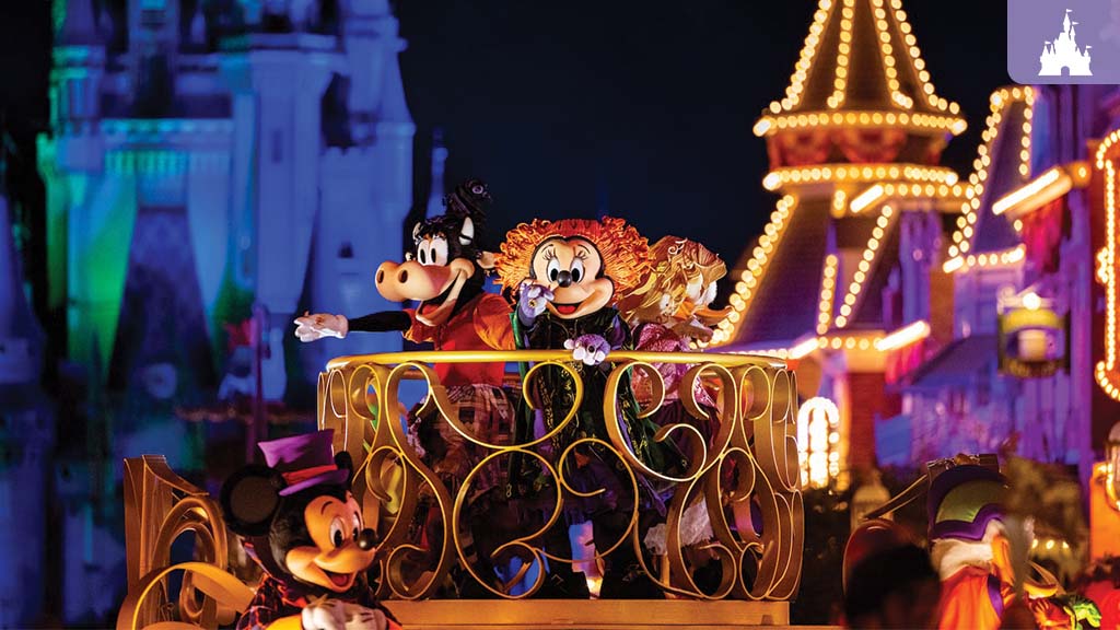 A colorful parade featuring cartoon characters on a float. The backdrop includes vibrant castle lights and festive decorations.