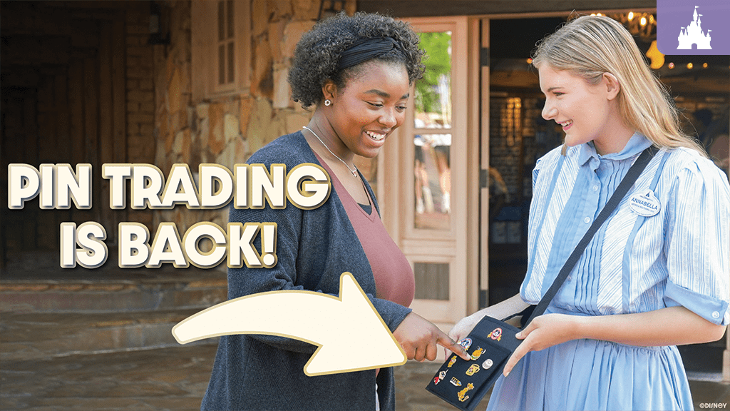 Two smiling women engage in pin trading outside a shop, with a prominent text overlay that reads "PIN TRADING IS BACK!"